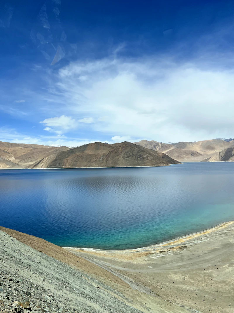 Blue Pangong Tso lake with high mountains in Ladakh